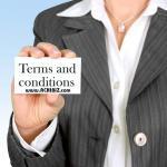 A person holding the sign with Terms & Conditions