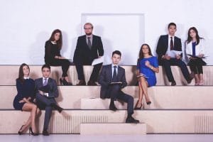 A group of people sitting on the steps