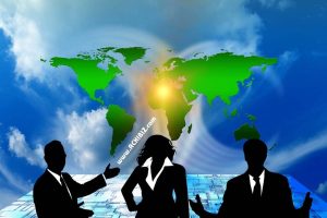 3 persons standing in front of world globe 